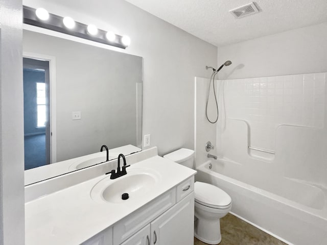 full bathroom featuring vanity, toilet, tub / shower combination, and a textured ceiling