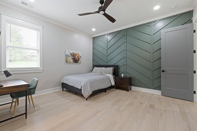 bedroom featuring ceiling fan and light hardwood / wood-style floors