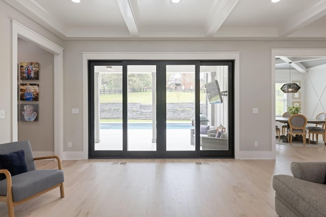 doorway to outside featuring french doors, plenty of natural light, beam ceiling, and light hardwood / wood-style floors