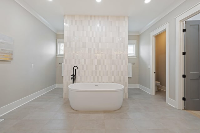 bathroom with toilet, tile walls, ornamental molding, a bath, and tile patterned flooring