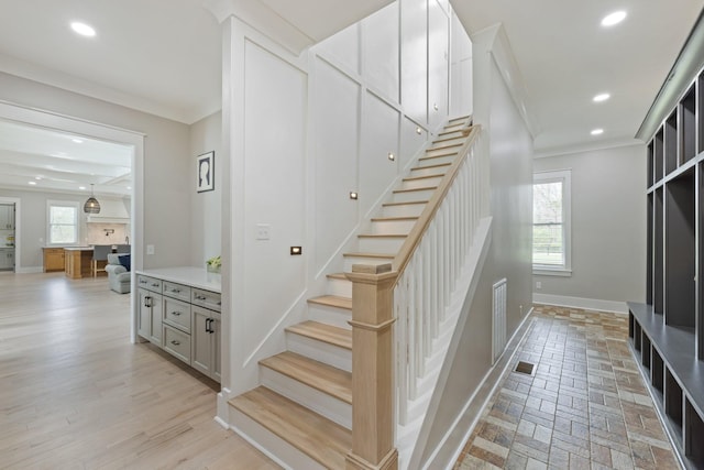 stairs featuring ornamental molding