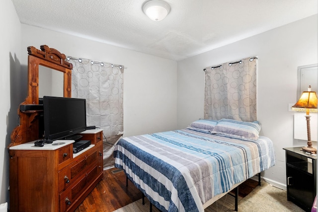 bedroom featuring a textured ceiling