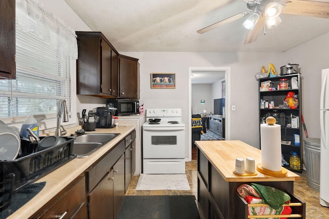 kitchen with sink, a textured ceiling, dark brown cabinetry, and electric stove