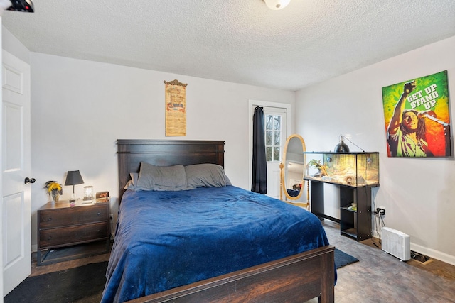 bedroom featuring a textured ceiling