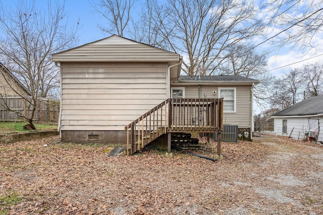 back of house with a deck