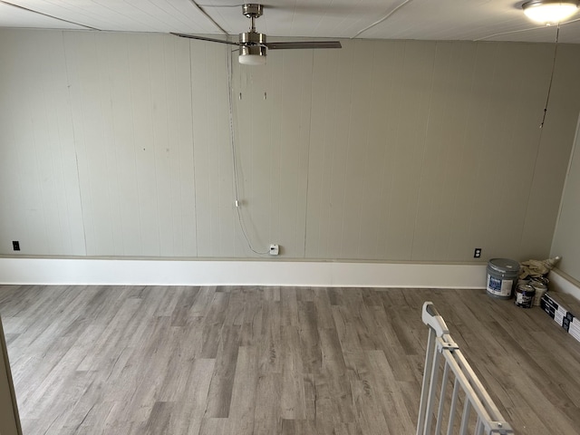 unfurnished room featuring ceiling fan and wood finished floors