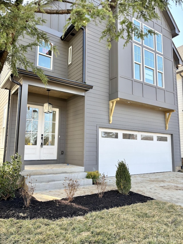 view of front facade featuring a garage and french doors