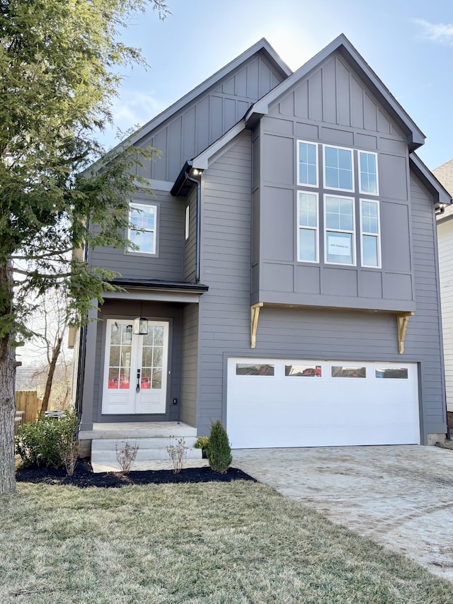 view of front of home featuring a garage and a front lawn