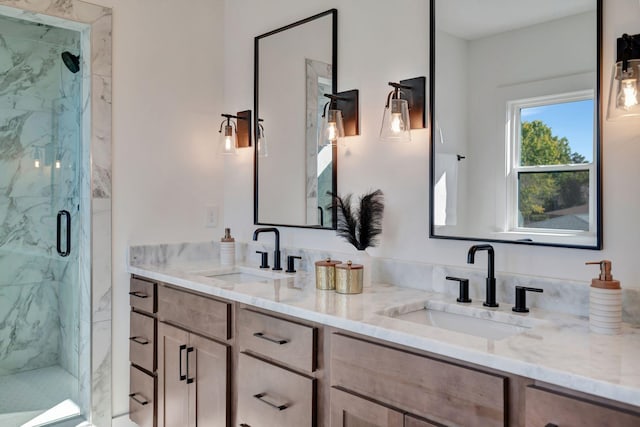 bathroom with vanity and a shower with door