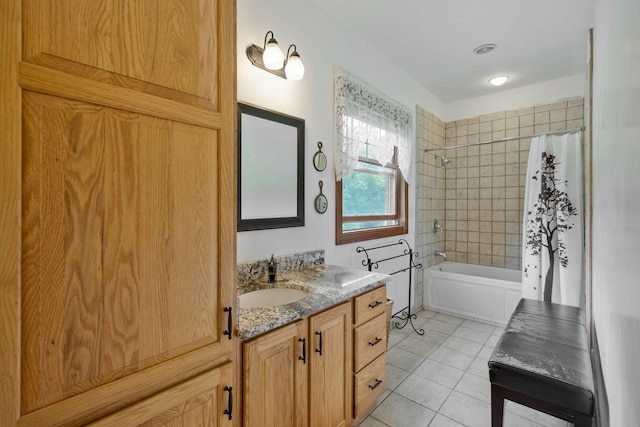 bathroom with vanity, shower / tub combo with curtain, and tile patterned floors