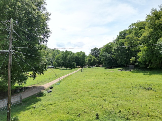 view of yard with a rural view