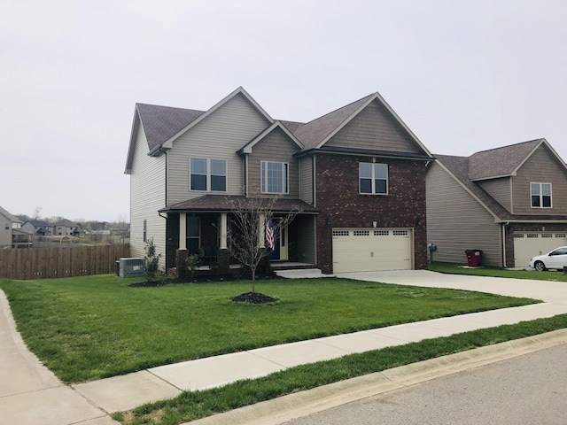 view of front of home featuring an attached garage, central air condition unit, fence, concrete driveway, and a front yard