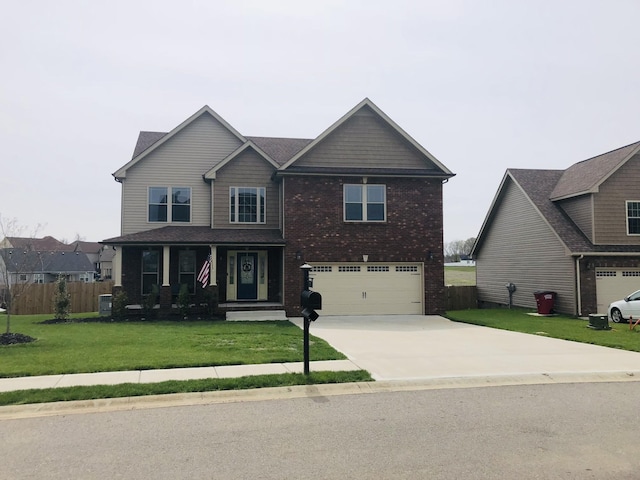 craftsman house with an attached garage, a front lawn, concrete driveway, and brick siding