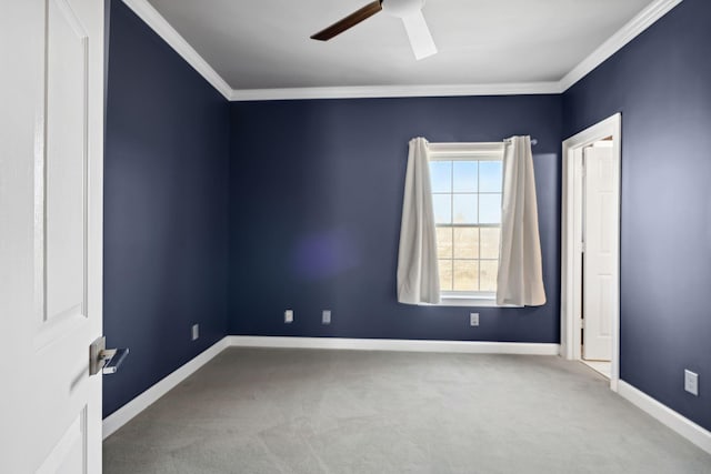 unfurnished room featuring ceiling fan, ornamental molding, and carpet flooring