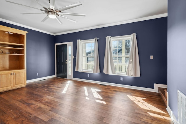 spare room with ornamental molding, ceiling fan, and dark hardwood / wood-style flooring