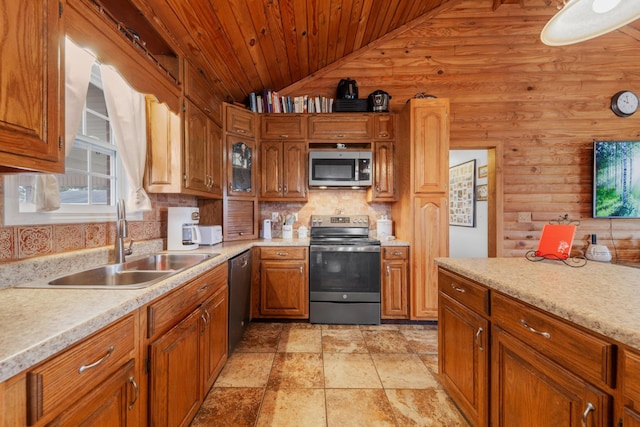 kitchen with sink, wood ceiling, vaulted ceiling, appliances with stainless steel finishes, and decorative backsplash