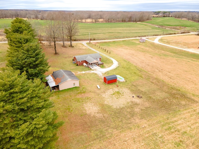 birds eye view of property with a rural view