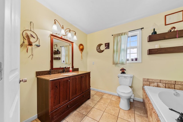 bathroom featuring vanity, toilet, tile patterned flooring, and tiled tub