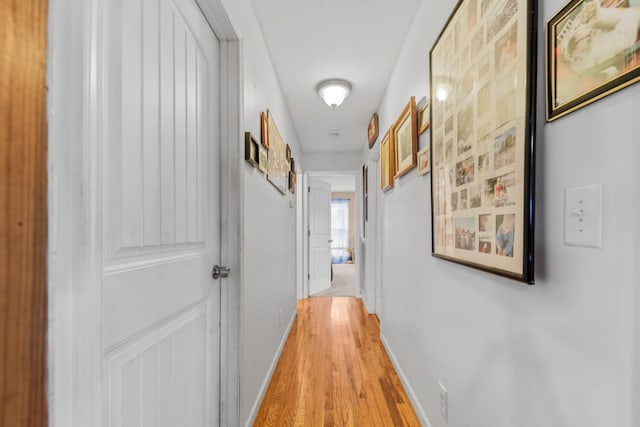 hall with light hardwood / wood-style floors