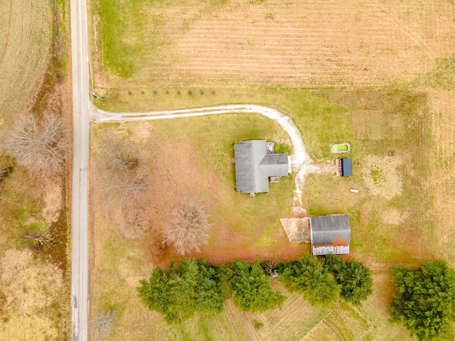 birds eye view of property with a rural view