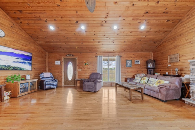 living room with high vaulted ceiling, wooden ceiling, light wood-type flooring, and wood walls