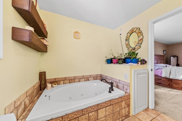 bathroom featuring a relaxing tiled tub and tile patterned flooring