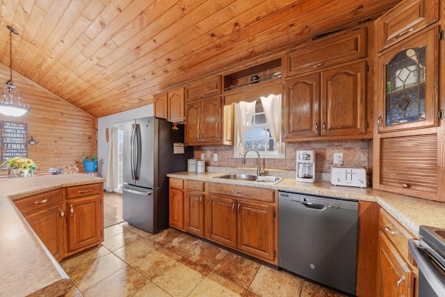 kitchen featuring appliances with stainless steel finishes, sink, decorative backsplash, hanging light fixtures, and wooden ceiling