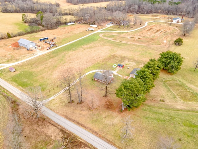 birds eye view of property with a rural view