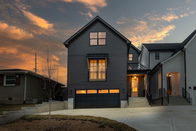 modern inspired farmhouse with a garage