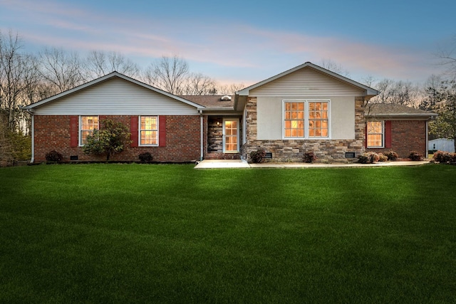 view of front of house with a yard