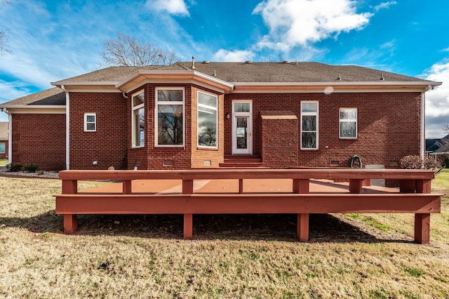 back of property featuring a yard and a deck