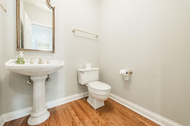 bathroom featuring toilet and hardwood / wood-style floors