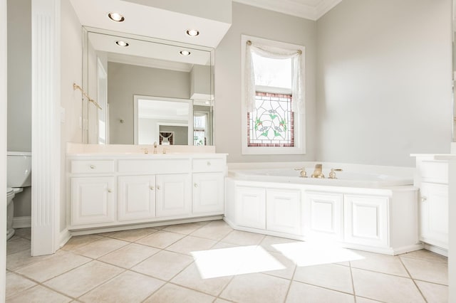 bathroom with a tub to relax in, tile patterned flooring, ornamental molding, vanity, and toilet