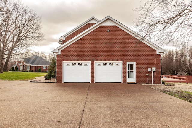 view of side of property featuring a garage