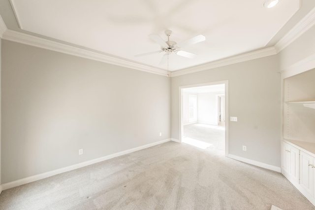 carpeted empty room with ornamental molding and ceiling fan