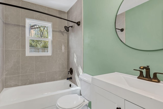 full bathroom with vanity, toilet, and tiled shower / bath combo