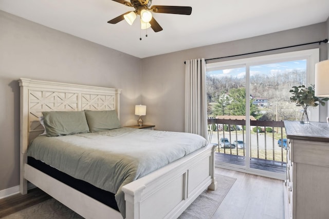 bedroom featuring hardwood / wood-style floors, access to exterior, and ceiling fan