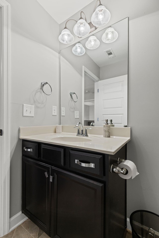 bathroom with vanity and tile patterned flooring