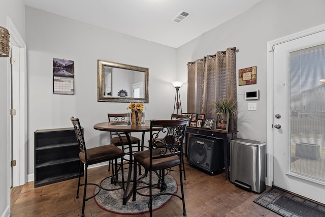 dining area featuring dark hardwood / wood-style floors