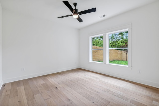 spare room with light hardwood / wood-style flooring and ceiling fan