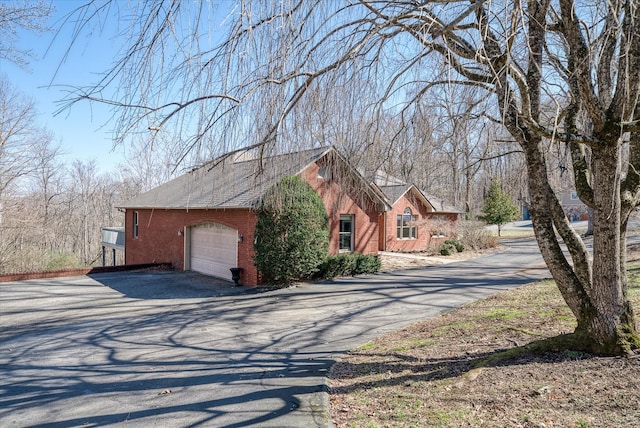 view of side of property featuring a garage