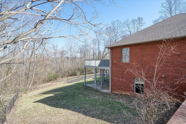 view of yard with a wooden deck