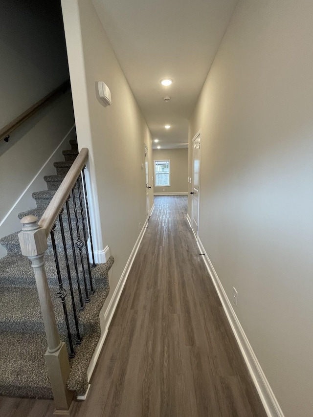 hallway featuring dark hardwood / wood-style floors