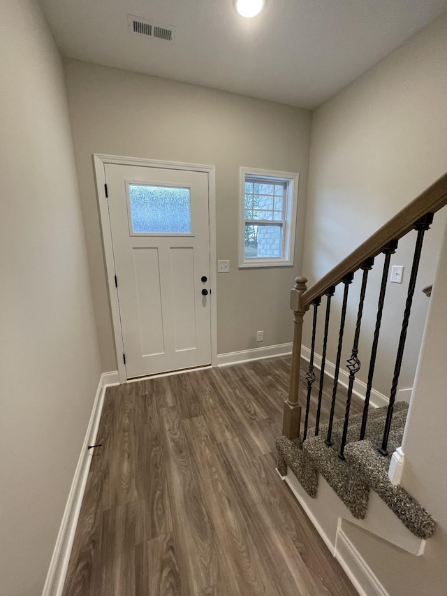 entrance foyer featuring dark hardwood / wood-style floors