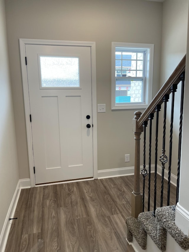 entrance foyer with dark hardwood / wood-style floors