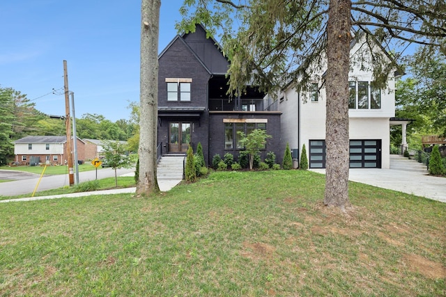 view of front of home featuring a garage and a front yard