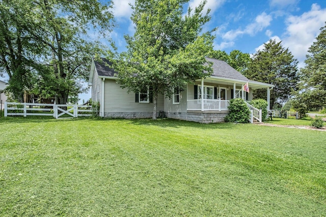 view of front of property with a porch and a front yard