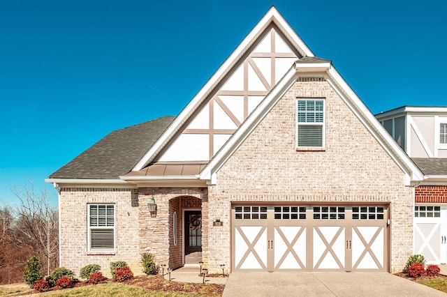 english style home with a garage