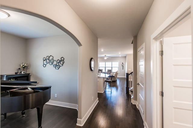 hallway with dark hardwood / wood-style flooring