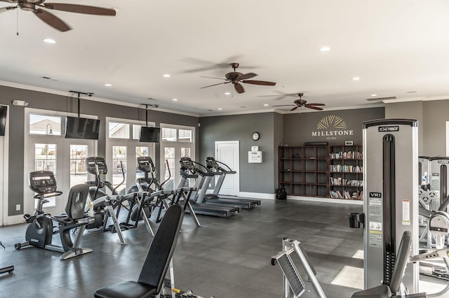 workout area featuring crown molding